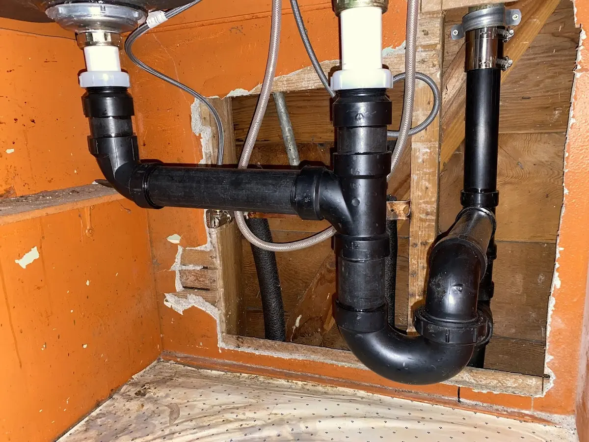 Professional Garbage Disposal Repair equipment and tools on the job in Piney Green
